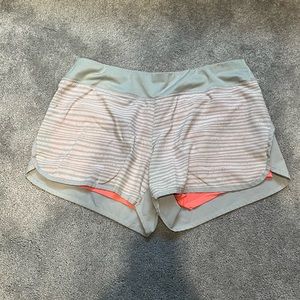 Women’s pink and grey Layer 8 performance shorts